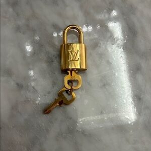 Louis Vuitton Gold Padlock and Key Set